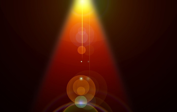 A spotlight illuminating the darkness